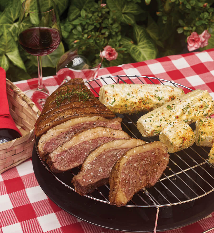 Picaña con choclos asados y gratinados
